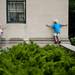 Eight-year-olds Logan Foster and Max Combs play on ledges near the main stage at Top of the Park  on Friday, June 21. Daniel Brenner I AnnArbor.com